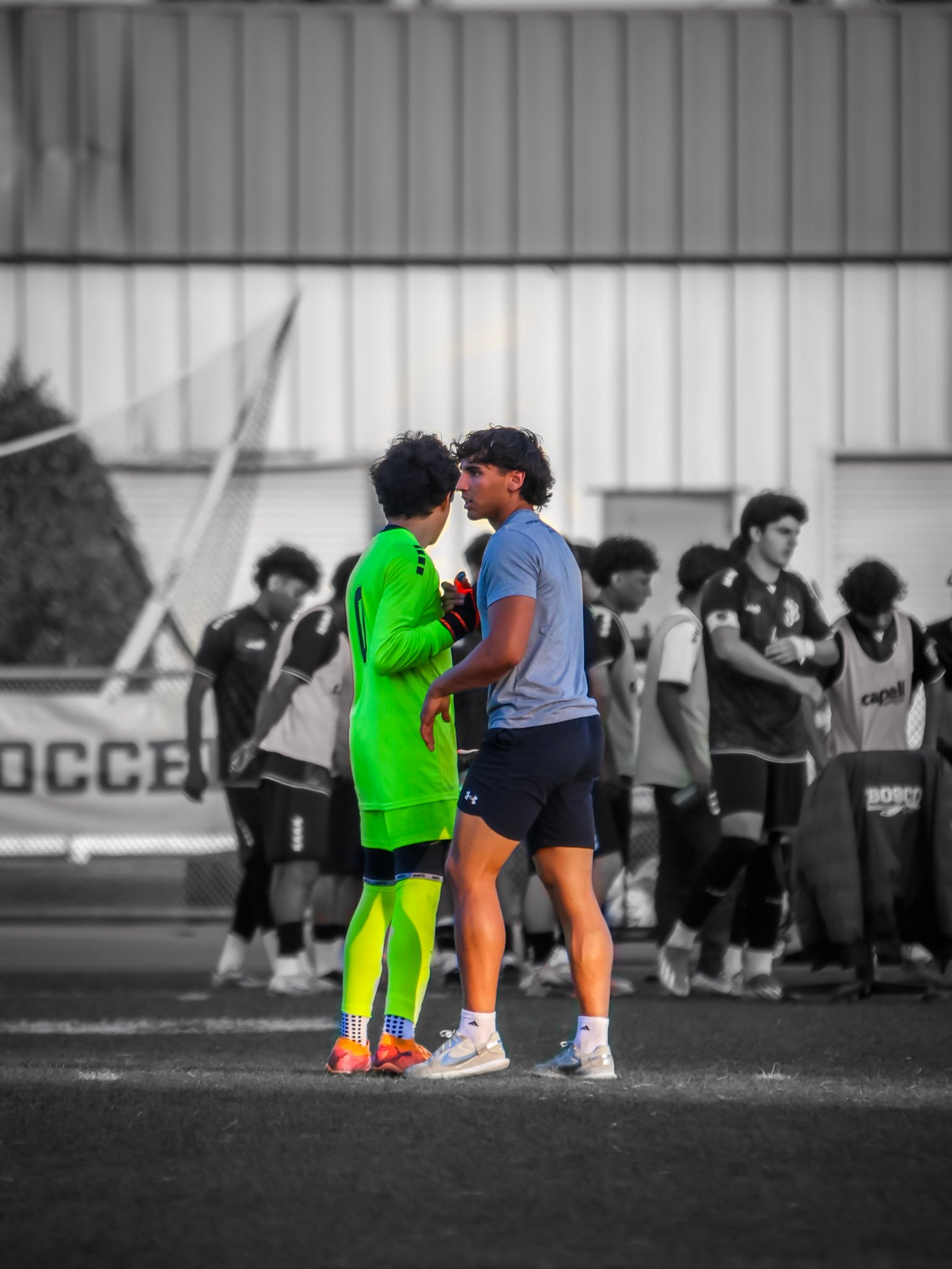 Players sharing a focused sideline moment